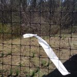 white streamer on fencing