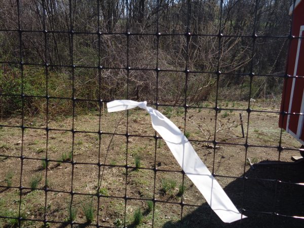 white streamer on fencing
